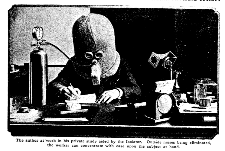 "The author at work in his private study aided by the Isolator.  Outside noises being eliminated, the worker can concentrate with ease upon the subject at hand."